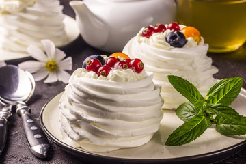 Delicious mini Pavlova meringue cake with berries