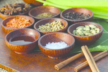 Wodden bowls with fresh spa treatment ingredience, tropical outdorrs