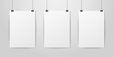 Three Vector Realistic White Blank Vertical A4 Paper Poster Hanging on a Rope with Binder Clip Set on White Wall mock-up. Empty Poster Design Template for Mockup