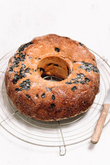 Traditional German or Austrian Gugelhupf or Kouglof from Alsace, France, a round bundt cake with raisins made of brioche yeast sponge or sweet bread dough and dusted with sugar