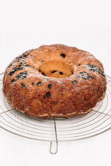 Traditional German or Austrian Gugelhupf or Kouglof from Alsace, France, a round bundt cake with raisins made of brioche yeast sponge or sweet bread dough and dusted with sugar