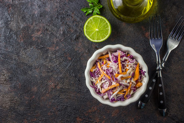 Fresh coleslaw salad made of shredded red and white cabbage and carrots