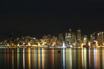 Fototapeta na wymiar Colorful Seattle City scape at night reflected in water