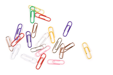 Close-up of multi-colored paper clips on a white background.