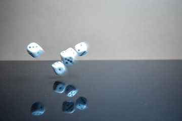 Flying, floating dice on a reflective background - 226879776