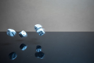 Flying, floating dice on a reflective background - 226879927