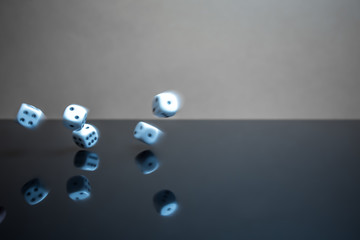 Flying, floating dice on a reflective background - 226879940
