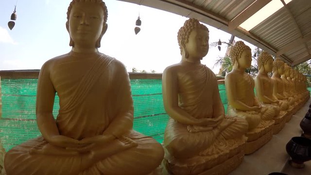 Group of golden Buddhist statues, POV