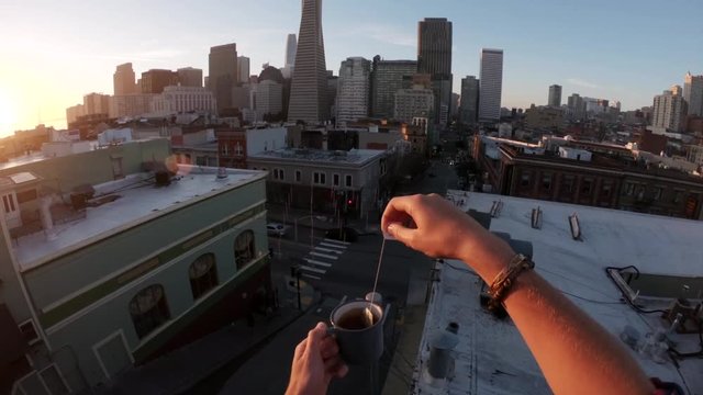 Sunset over San Francisco skyline, tilt down POV