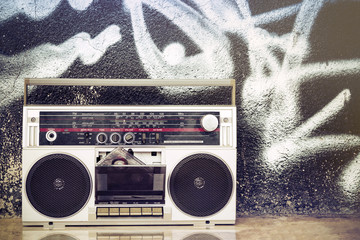 Retro boombox radio on a graffiti background