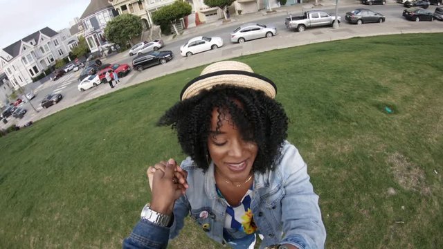 POV, happy couple dance in San Francisco park