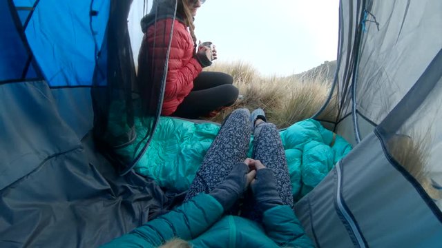 POV, sitting in tent on foggy mountaintop