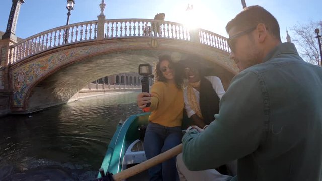 POV, people in rowboat in Seville
