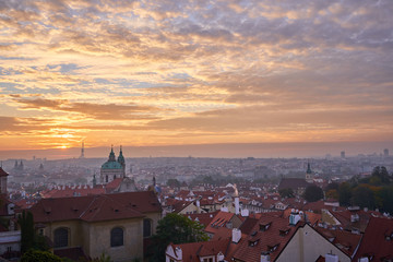 Fototapeta na wymiar Landcape or cityscape view on old town of Prague and Lesser town during the golden hour in sunrise with beautiful clouds and sun light taken from hill of prague castle. 