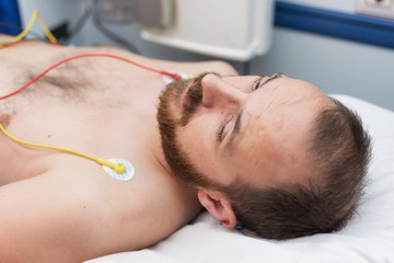 ecg electrodes on patient chest in ambulance