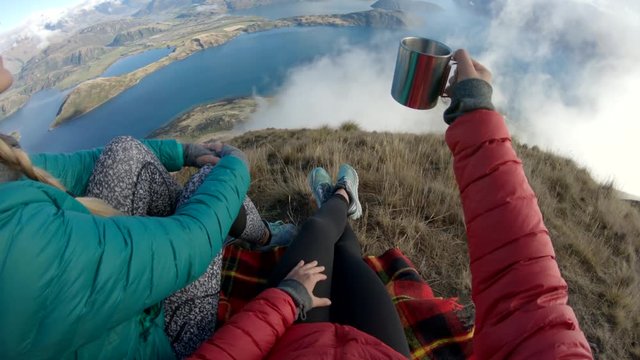 POV, friends cheers on mountaintop in Wanaka