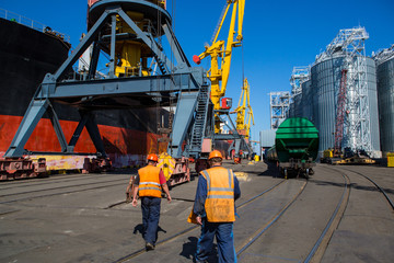 Fototapeta premium Panamax bulk carrier loaded with wheat. Ship at grain terminal. Port elevator with bulk carrier