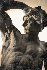Antique statue of Prometheus in front of the light for mankind as a symbol of freedom and strength...