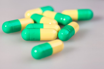 pills, capsules, on a white matte background