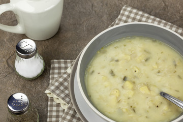 Bowl of creamy vegetable soup on a country table