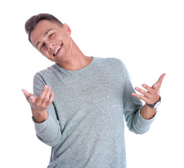 Portrait of handsome young man laughing on white background