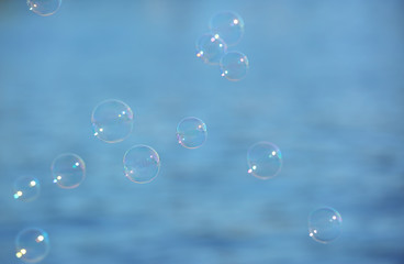 Beautiful translucent soap bubbles outdoors on sunny day