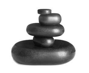 Stack of zen spa stones on white background