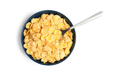 Bowl with crispy cornflakes on white background, top view