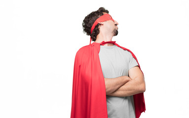 Young bearded super hero with a dissenting, serious, stern expression, with crossed arms in...