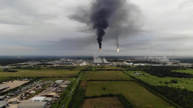 Chemical Plant Conducting Controlled Flaring to Burn Off Excess Materials in Channelview near Houston, Texas Filmed by Drone