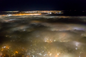 Fototapeta na wymiar Aerial View of Fog in San Francisco Bay Area at Night