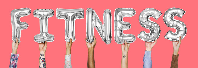 Hands showing fitness balloons word