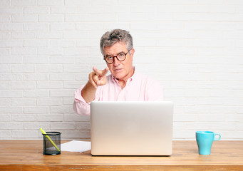 senior businessman looking, observing, keeping an eye on an object in front, or watching out for...