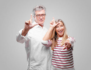 senior cool husband and wife gesturing 
