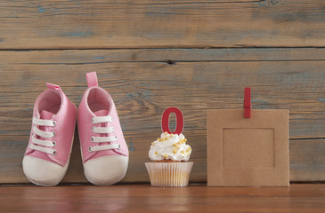 Delicious birthday сupcakes for a baby shower on wooden background