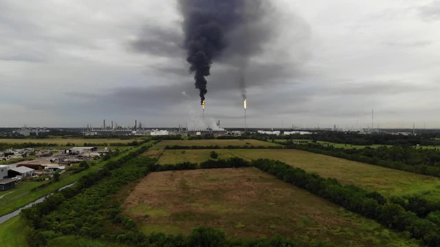 Chemical Plant Conducting Controlled Flaring to Burn Off Excess Materials in Channelview near Houston, Texas Filmed by Drone