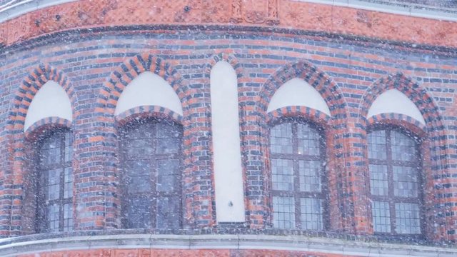 Heavy snowfall, Holsten Gate or Holstentor in Lubeck