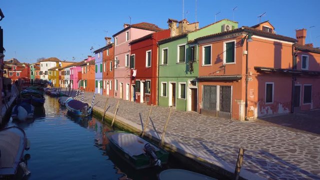 canal with multicolored houses of Burano island, Venice, Italy