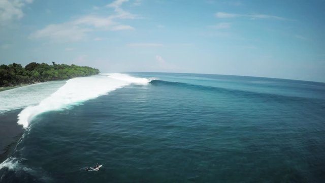 Wide aerial, surfers near Mentawai Island