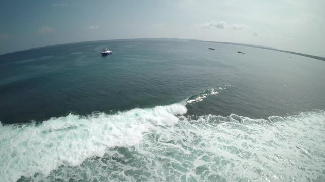 Panning aerial, boat outside Mentawai Island