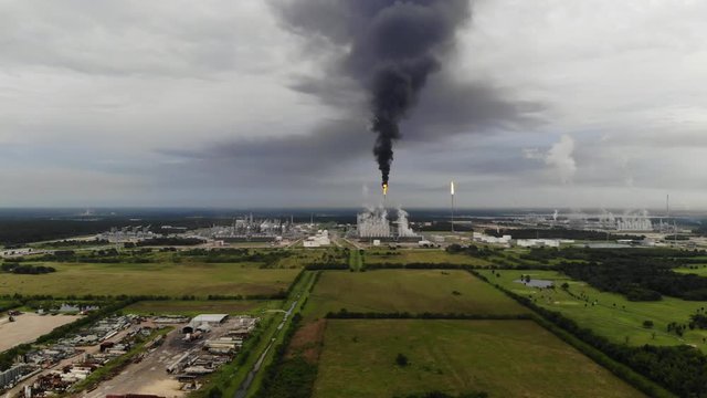 Chemical Plant Conducting Controlled Flaring to Burn Off Excess Materials in Channelview near Houston, Texas Filmed by Drone