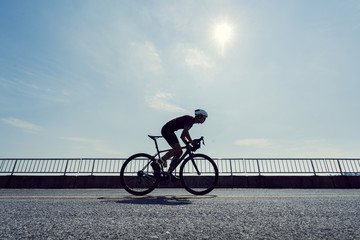 Fototapeta premium Asian man cycling road bike in the morning