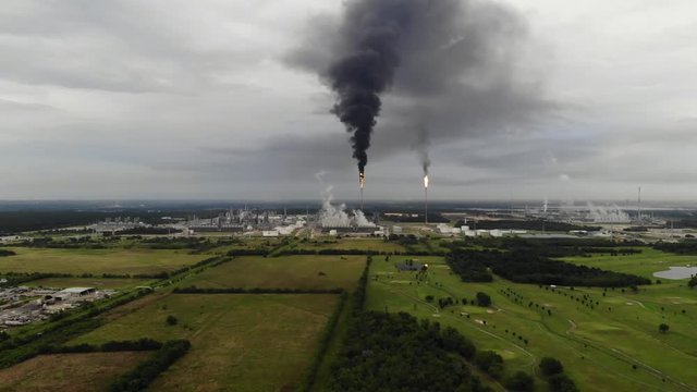 Chemical Plant Conducting Controlled Flaring to Burn Off Excess Materials in Channelview near Houston, Texas Filmed by Drone