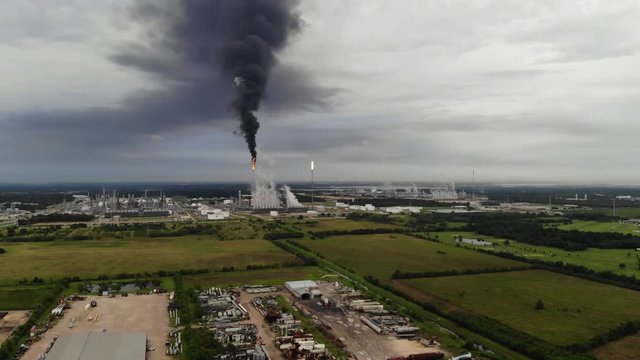 Chemical Plant Conducting Controlled Flaring to Burn Off Excess Materials in Channelview near Houston, Texas Filmed by Drone