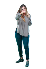 young beautiful girl with an angry, aggressive and menacing pose, ready for the fight, showing...