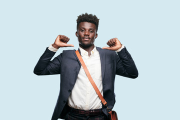 young black businessman with a proud, happy and confident expression; smiling and sure of success,...