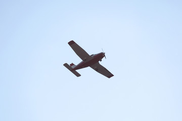single-engine light aircraft flying in the sky