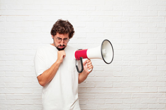 young dumb man Coughing, suffering a winter illness such as a cold or the flu, feeling unwell and feverish.