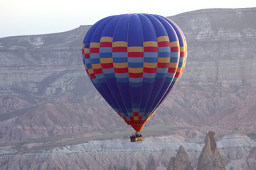 Obraz premium balloon is flying in mountainous area in Cappadocia. Turkey
