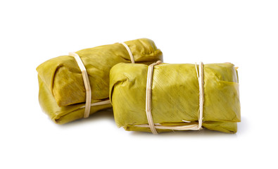 Thai Dessert, steamed Sticky Rice with banana Leaf isolated on white background